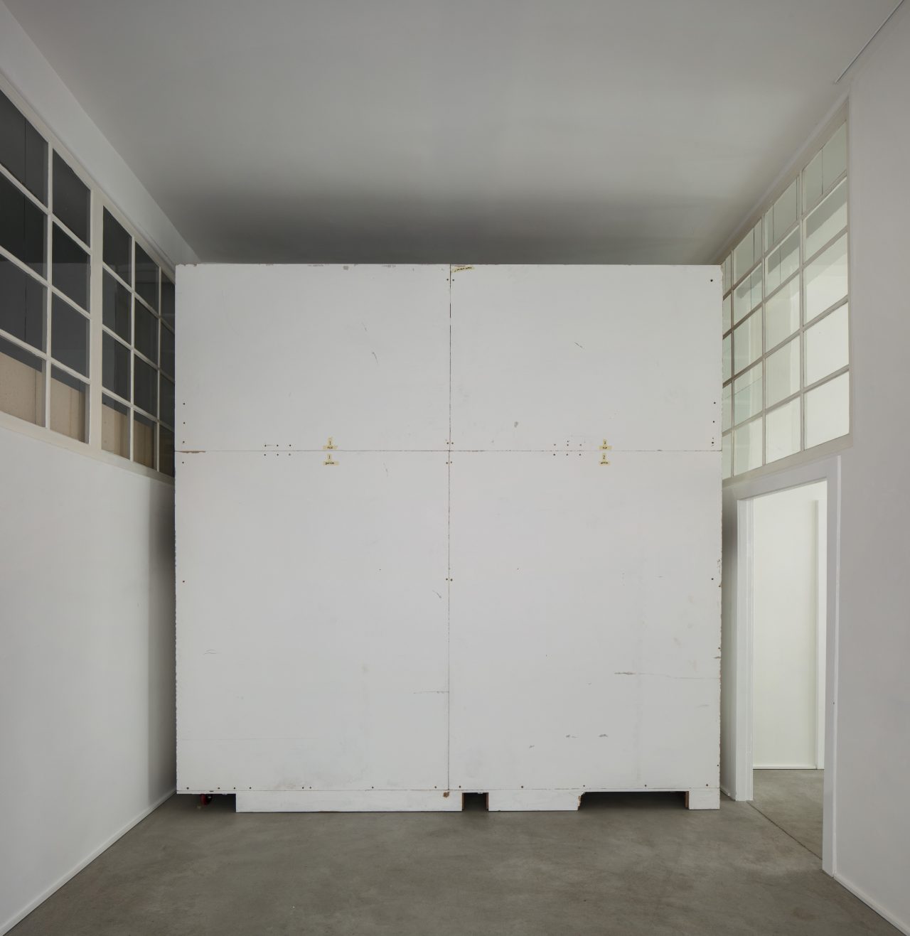 Christopher Williams: Wall designed by Dirk Ufermann, Head Technician, Bonner Kunstverein, Bonn. Constructed by Objekt Design Persighetti Ltd. for the exhibition Open Letter: The Family Drama Refunctioned? (From the Point of View of Production), 17 March - 20 May, 2017, David Zwirner, London after drawings by Pasztori Simons Architects, Berlin with Avery Dennison 507 EF Event Film Matt vinyl installed by Imga Imaging Ltd. Kent, UK (6/6) 2017 Plywood, metal, wood, and adhesive vinyl 350 x 350 x 57 cm Wall constructed by Objekt Design Persighetti Ltd, Leichlingen, Germany Vinyl installed by Igma Imaging Ltd., Kent, UK, 2017 Plywood, metal, wood, and adhesive vinyl 137 7/8 x 137 7/8 x 22 1/2 inches 350 x 350 x 57 cm WILCH0549